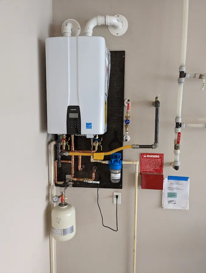 Professional plumber installing copper piping in a Catalina Foothills home